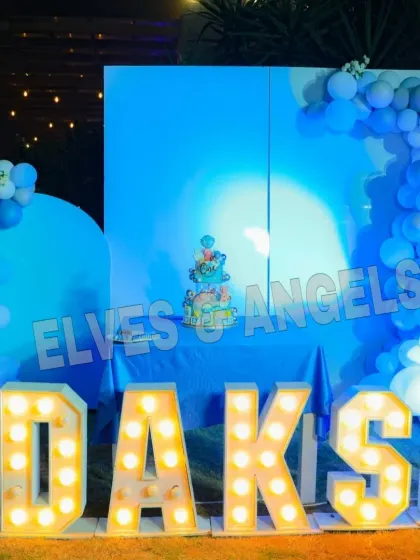 The blue-lit stage for Daksh's party, creating a cool and modern vibe.