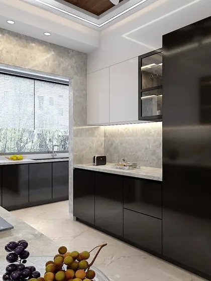 An overall view of the monochrome kitchen, highlighting the ample counter space and under-cabinet lighting that makes the workspace bright and efficient.