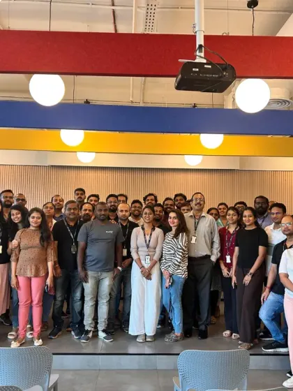 A happy and refreshed team after a corporate wellness session focused on yoga and mindful living.