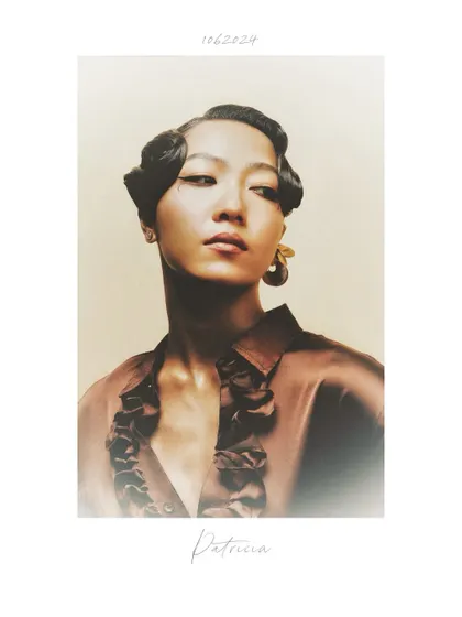 A vintage-inspired look from the "Patricia" series. The sculpted finger waves and warm, hazy tones give this portrait a timeless, almost 1920s feel.