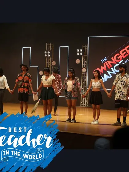 Our teachers and students holding hands on stage. We are a family, and our instructors are the heroes who guide and inspire us every day.