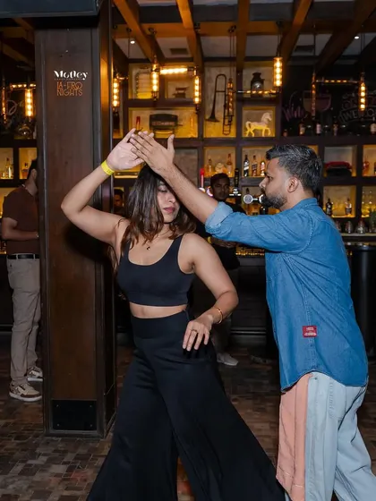 Feeling the rhythm of the music during a partner dance. Our socials are the perfect place to practice your moves and connect with other dancers in a relaxed pub atmosphere.