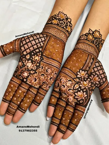 A symmetrical pair of palm designs that play with different patterns. One side features a checkerboard, while the other has swirling yin-yang like motifs, all tied together with lotus flowers.