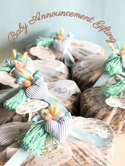Our handcrafted baby announcement hampers are the sweetest way to share the news. These baskets are wrapped with care and feature adorable custom tags.