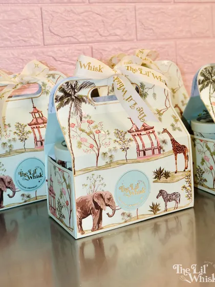 A look at the beautiful, custom-designed packaging for our Rakhi hampers. The elegant safari and chinoiserie print makes the gift feel luxurious before it's even opened.