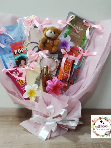 The final pink-themed gift bouquet, all wrapped up and ready to be delivered. It's a fun and practical alternative to a flower arrangement.