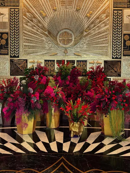 I was ecstatic to create the first lobby installation for the stunning Fairmont Mumbai. I used bold red and magenta florals in golden vases to complement the hotel's opulent art deco interiors, creating a dialogue between my art and the architecture.