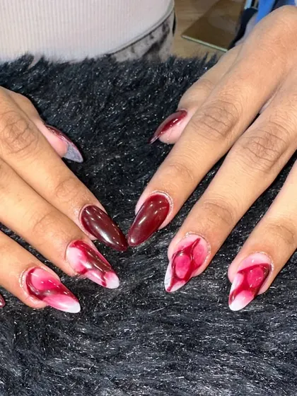 A beautiful watercolor or "blooming" ink effect. This design uses shades of deep red on a milky white base to create a soft, artistic look that’s both edgy and romantic.