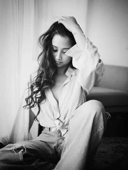 A quiet, introspective black and white portrait.
