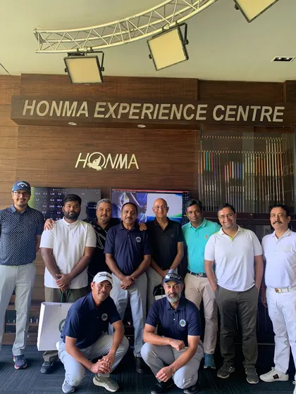 A Group Photo of Men's Golf Camp Participants: The Men's Golf Camp is about building skills and connections. Participants and instructors gather for a group photo at our Honma Experience Centre, celebrating a successful camp filled with learning and friendly competition.