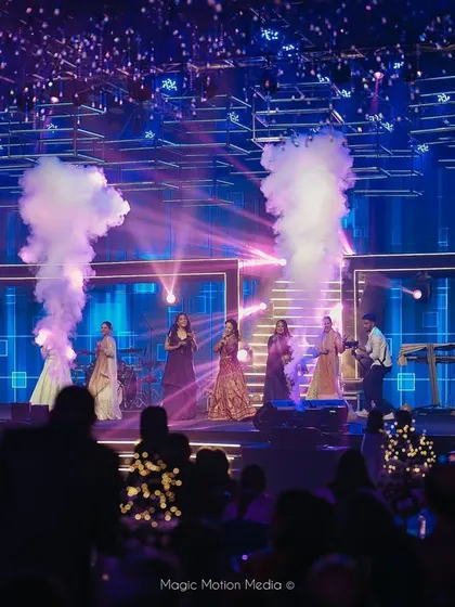 The band performs on the celestial-themed Sangeet stage, with CO2 jets adding a burst of energy to the celebration.