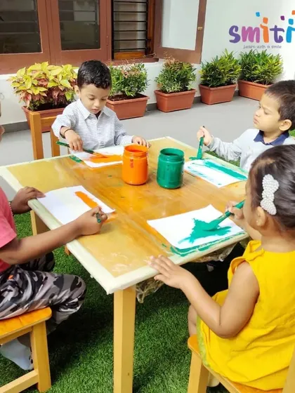 Children paint khadi cloth to create the Indian tricolor flag for Independence Day. This activity connects them to the history and texture of a material symbolic of our freedom struggle.