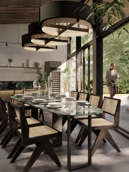 The dining area render for 'Kasu Vaha' is a space designed for connection, featuring a large eight-seater table under dramatic pendant lights, with a full view of the garden.