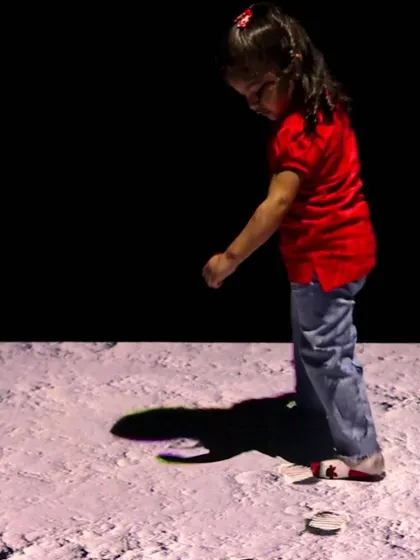 Taking a walk on the moon! Our animated floor can transport kids to another world.