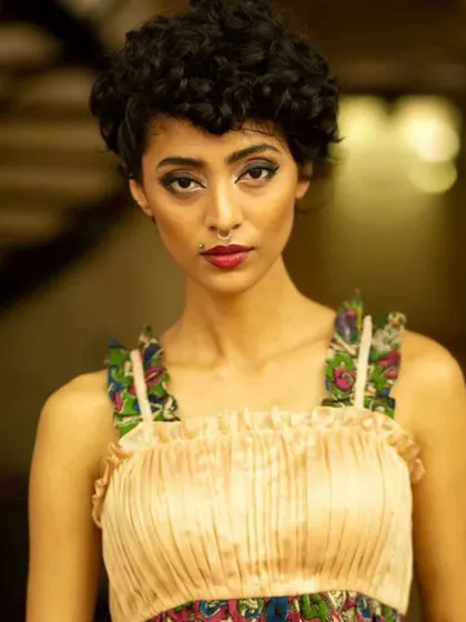 A modern take on Kalamkari, this smocked crop top features ruffled straps with a traditional print. It’s a perfect example of how our blouses can be styled for a fusion look.