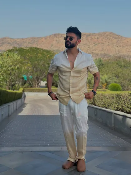 Another pose in the same stylish outfit. It's a versatile look that works well for daytime events.