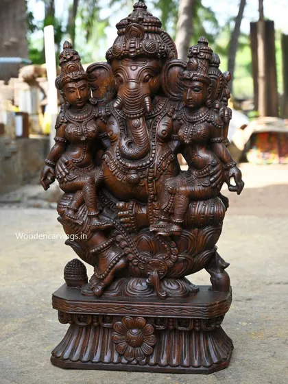 A 35.5-inch sculpture of Lord Ganesha with his two consorts, Buddhi (intellect) and Siddhi (spiritual power). This complete representation is a powerful symbol of a balanced and successful life.