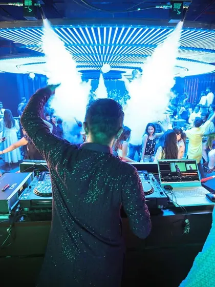 A view from behind the console at Plunge in Pune, with CO2 cannons creating wings of smoke behind me. This shot captures the power and production of my desi nights.