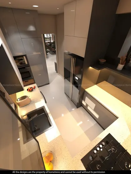 A top-down view of a U-shaped kitchen, showing the efficient 'golden triangle' layout. The combination of glossy grey and white cabinets, along with the speckled quartz countertop, creates a bright and modern workspace.