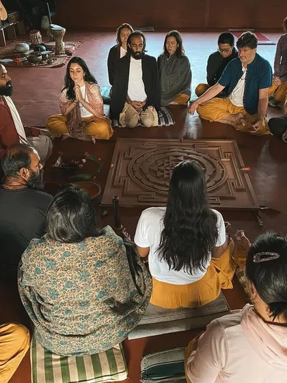 We gather in a circle for a fire ceremony. This high-angle shot shows the sense of community and shared purpose that defines our spiritual gatherings.