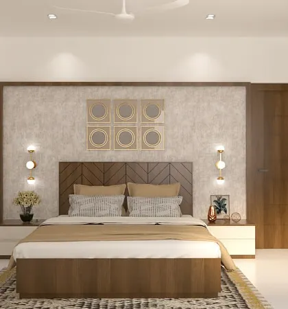 A full view of the bedroom, showing the textured wallpaper behind the wooden headboard. The combination of materials and layered lighting creates a warm and inviting retreat.