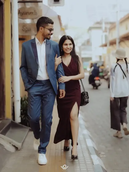 A candid shot of a couple walking down a charming street, perfect for a relaxed and natural pre-wedding photography session.