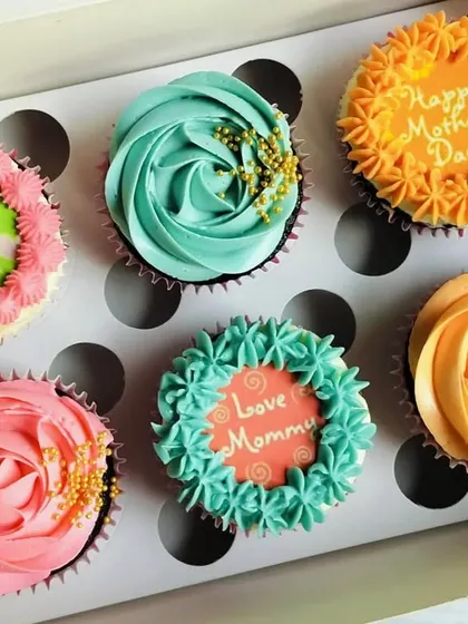 For Mother's Day, I created this colorful assortment of cupcakes. Each one has a unique design and message, like "World's Best Mom" and "Love you Mommy," to make her feel extra special.