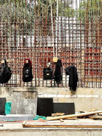 A wall of reinforcing steel bars (rebar) at the New Delhi site. This dense mesh provides the tensile strength for the concrete walls and slabs.