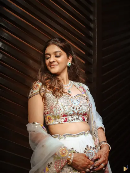 A candid, happy moment. This photo captures the joy and radiance of the bride, with her soft glam makeup looking effortlessly perfect.