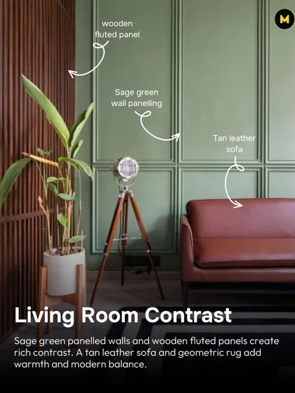 This living room shows how to create rich contrast with materials. Sage green panelled walls are paired with wooden fluted panels, while a tan leather sofa adds warmth and modern balance.