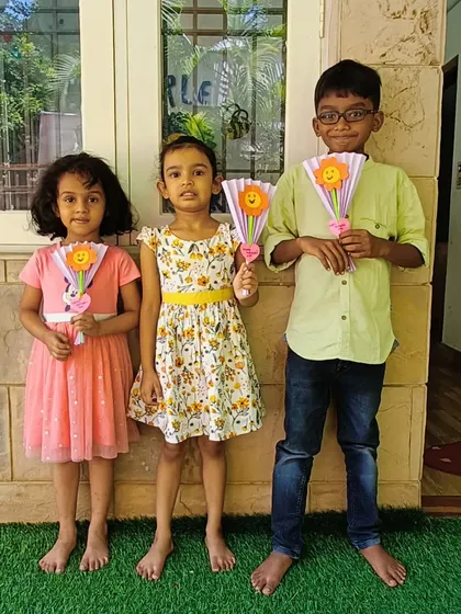 These campers are ready for a sunny day with their handmade paper fan crafts. A practical and fun project for a warm summer afternoon.