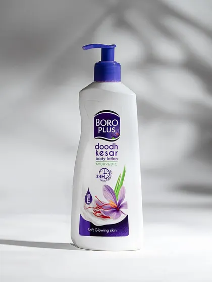 A clean studio shot of Boro Plus body lotion, using soft shadows to create depth. This image clearly presents the product's packaging for easy recognition on e-commerce platforms.