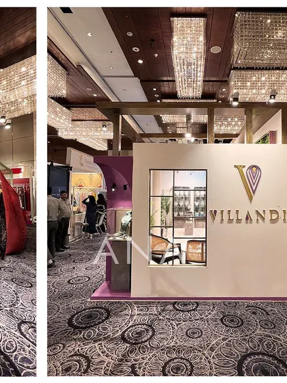 The facade of the Villandi '22 booth featured window-like openings, giving it the feel of a high-end boutique. The design balances visibility with a sense of privacy for the clients inside.
