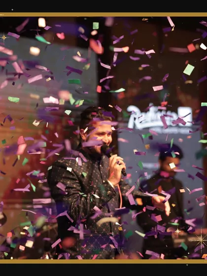 The energy of a live performance is unmatched. This shot captures a singer on stage during a New Year's Eve party we organized, with confetti raining down, creating a high-energy, celebratory moment.