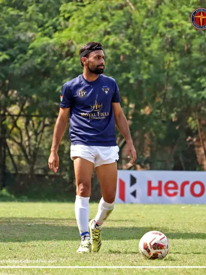 A senior player from our partner club, Frontier FC, during an A Division league match. This shows the professional pathway available to our academy graduates.