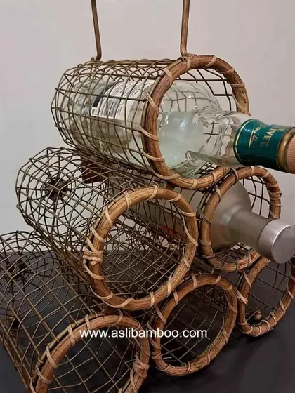 A close-up of our handcrafted rattan and cane wine rack, designed to store six bottles securely. This piece combines rustic charm with functional design, making it a unique and stylish addition to any home bar or kitchen space.