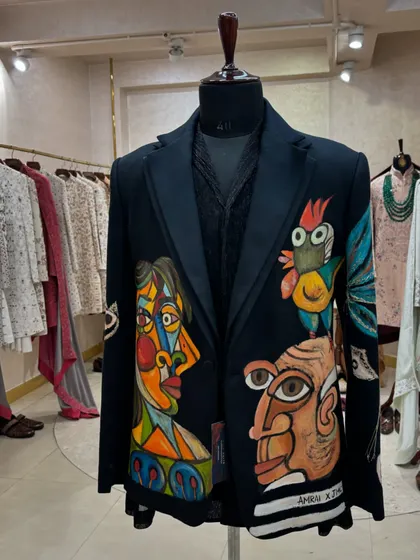 This hand-painted blazer from Jatin Malik Couture is a piece of wearable art. I often work with such unique menswear pieces for editorial shoots that require a bold, artistic statement.