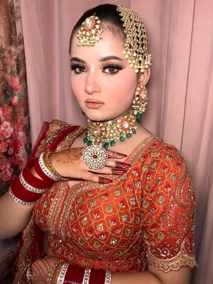 A regal pose, highlighting the stunning oversized ring and the perfect red manicure.