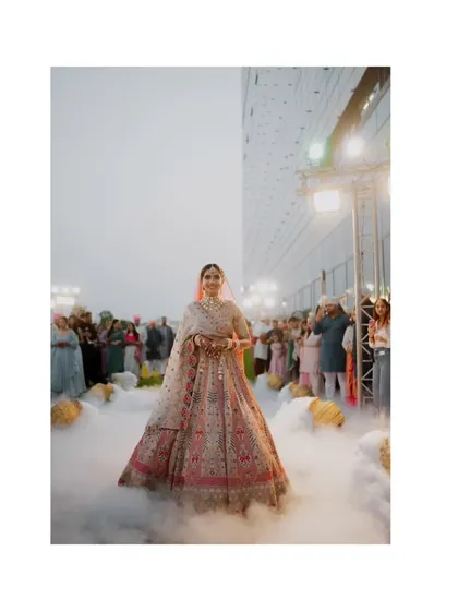 The bride's entrance is a moment suspended in time. I used a low-angle shot with theatrical smoke to create this ethereal, almost magical atmosphere, making her look like she's floating toward her future. It’s about making the grand moments feel deeply personal and unforgettable.
