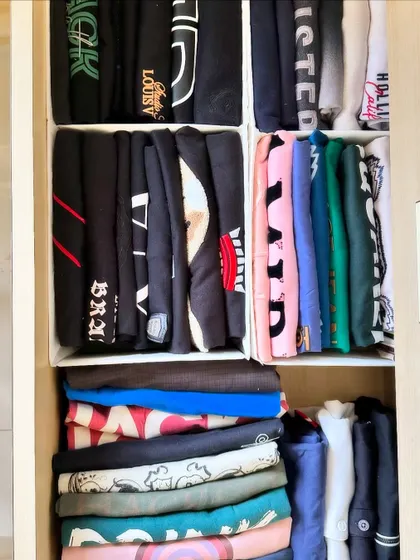 Notice how some items are file-folded while others are stacked. We customize our approach based on the item and the space to create the most effective system.