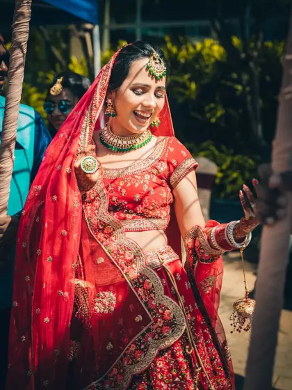 The ecstatic, candid laughter of a bride on her wedding day. We capture these unposed moments of pure happiness.