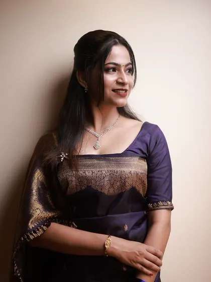 A polished and sophisticated look for any party or event. The makeup is timeless and enhances her natural beauty.