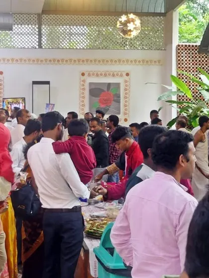 A busy buffet area where guests are exploring the various dishes on offer. I ensure the layout is spacious to avoid crowding and allow for a comfortable experience.
