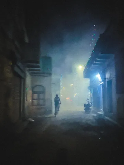a foggy street scene at night in banaras. the mood and atmosphere in this shot are what i aim to capture in my more stylistic design projects.