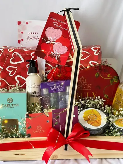 This birthday hamper is a perfect blend of pampering and indulgence, with skincare items from The Body Shop and a variety of sweet treats.