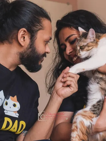 A beautiful moment of connection between a calico cat and her parents. Capturing the quiet trust and love between pets and their humans is what I do best.