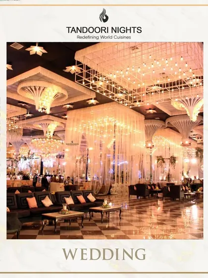 The epitome of a grand celebration. This image shows a reception hall with breathtaking crystal chandeliers and elegant lounge seating, an environment where our luxury catering feels right at home.