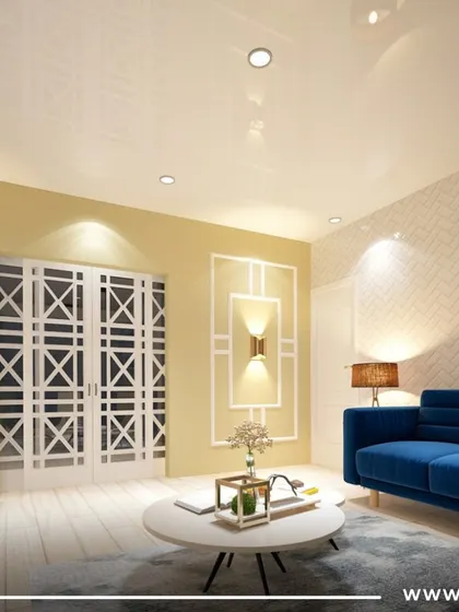 An eclectic living room from a 3BHK project in Pune. A bold blue sofa is paired with neutral walls and classic white jali-style doors, creating a vibrant and unique space.