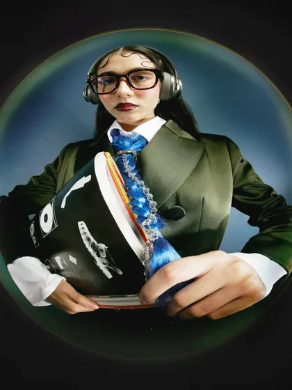 A variation of the fisheye portrait, with the model now wearing headphones. This small change in propping adds another layer to the character, suggesting a world of internal focus and sound.
