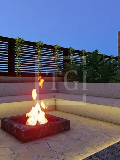 This render for the Tagore Garden project features a cozy fire pit with built-in concrete seating, perfect for chilly evenings.